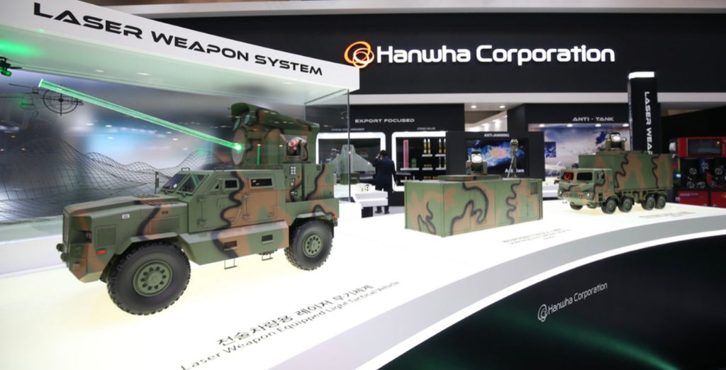 Hanwha Defence displays models of laser-based weapon systems.